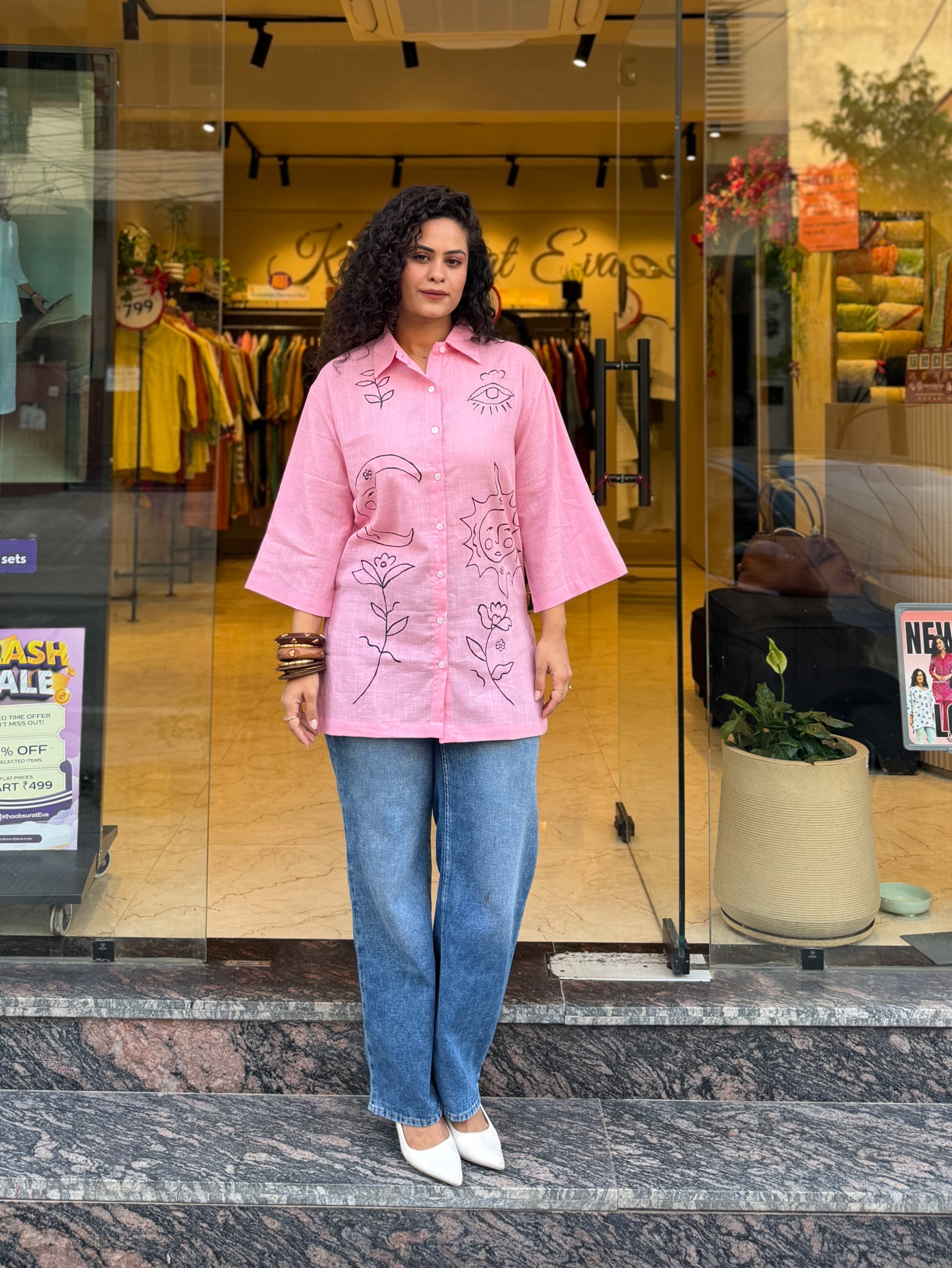 Woman wearing a pink floral top shirt